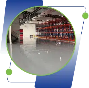 An empty warehouse with red storage racks and a glossy floor.