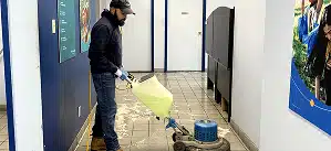 Professional commercial floor cleaning with a floor scrubber machine