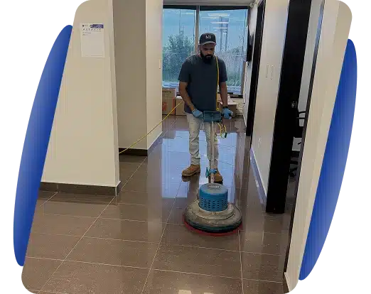 A cleaner operating a floor buffing machine in a shiny hallway, framed by blue and white graphics.