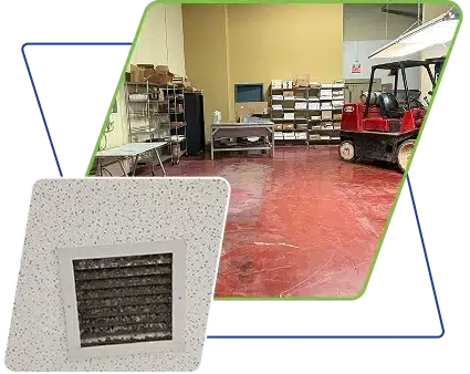 A red forklift parked on a glossy red floor in a warehouse.